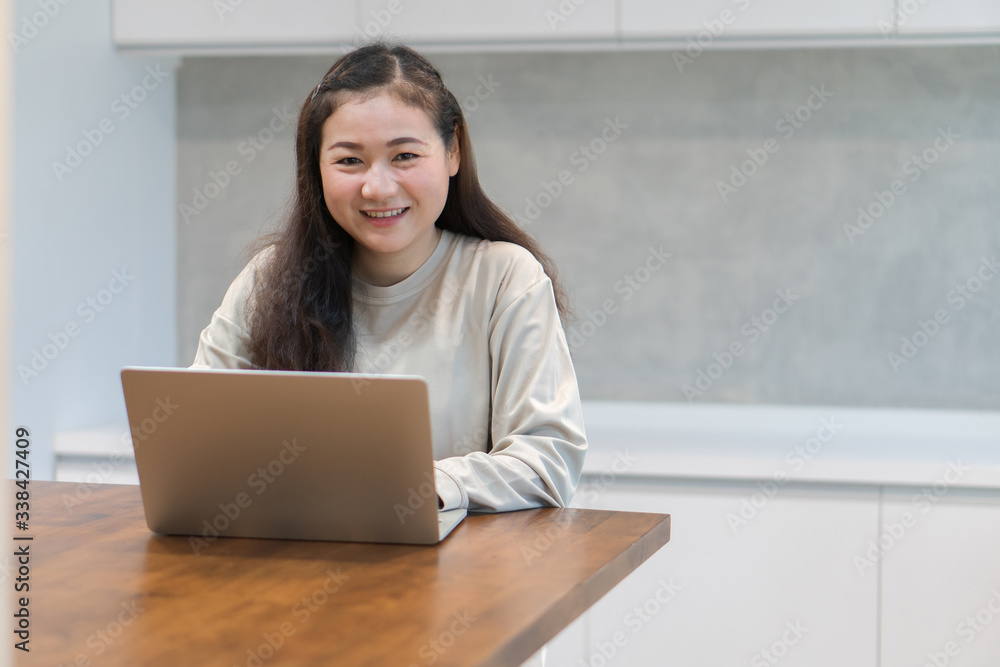 Happy asian women work from home during the epidemic. Concept of coronavirus (COVID-19) quarantine Happy asian women work from home during the epidemic. Concept of coronavirus (COVID-19) quarantine