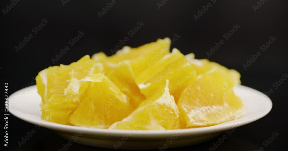Extreme Close up of Sliced Orange Rotating on Plate Extreme Close up of Sliced Orange Rotating on Plate