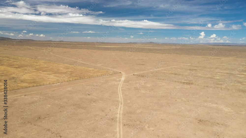 Drone flying over the Kenyan plains and desert. The drone follows a dusty road and passes some fences. The area is very desolate. Drone stock footage by DroneRune Drone flying over the Kenyan plains and desert. The drone follows a dusty road and passes some fences. The area is very desolate. Drone stock footage by DroneRune