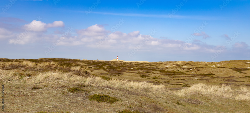 dunes with small lighthouse