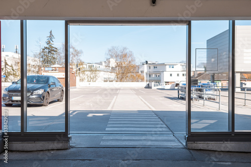 Door opening in front of parking lot on shopping mall roof