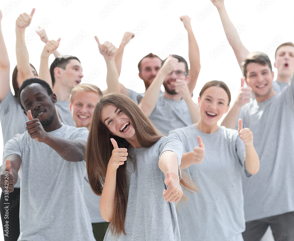 group of happy young people showing thumbs up. group of happy young people showing thumbs up.