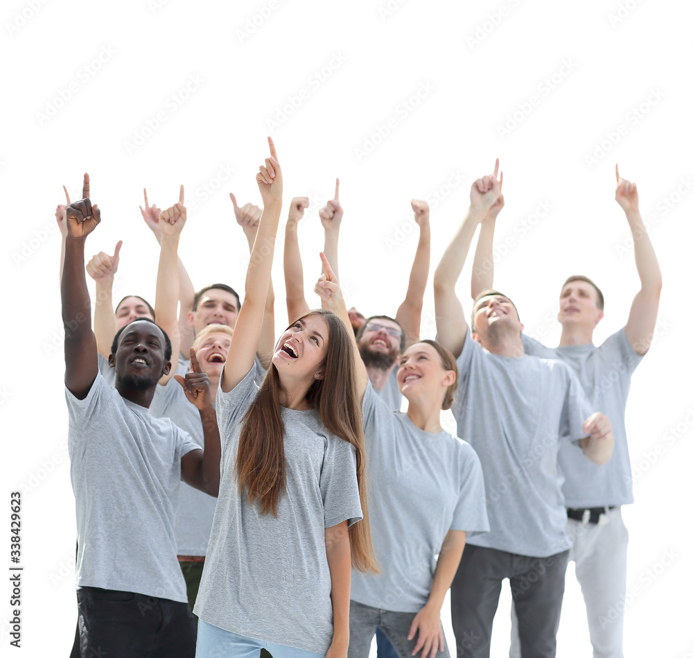 happy young people pointing somewhere up. photo with copy space happy young people pointing somewhere up. photo with copy space