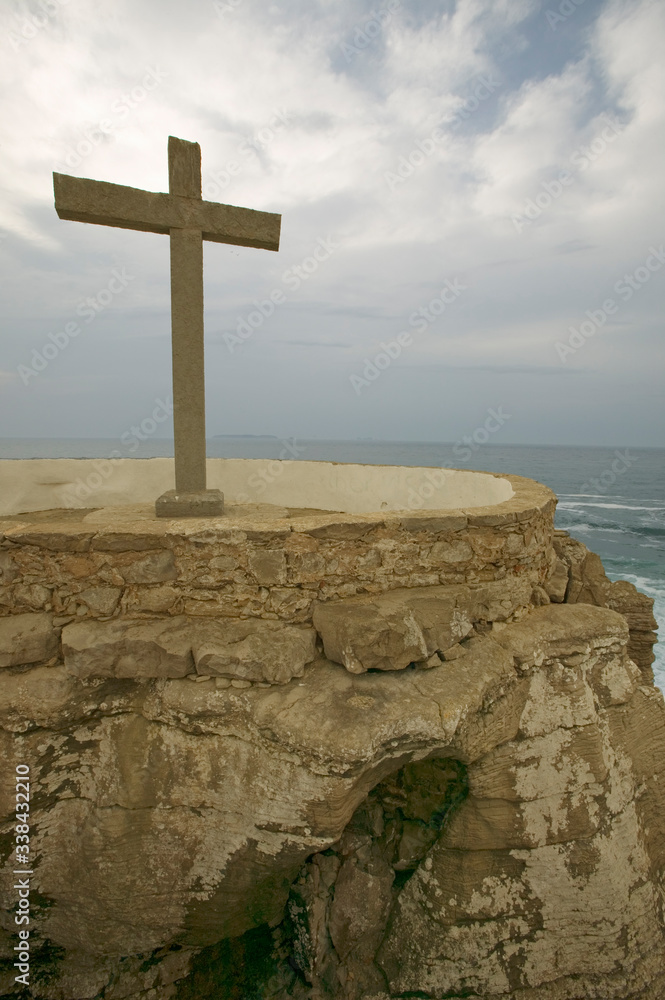 Cross overlooks Atlantic Ocean at Cruz do Remedios, near Peniche, west coast of Portugal