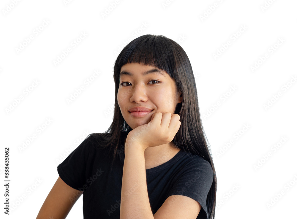 beautiful teenage girl with her hand on chin smiling on white background. beautiful teenage girl with her hand on chin smiling on white background.