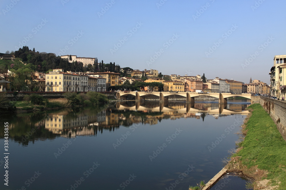 View of Florence from the Arno River, palaces are reflected in the river. Morning