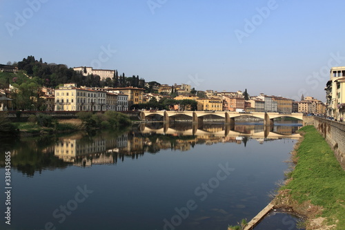 View of Florence from the Arno River, palaces are reflected in the river. Morning
