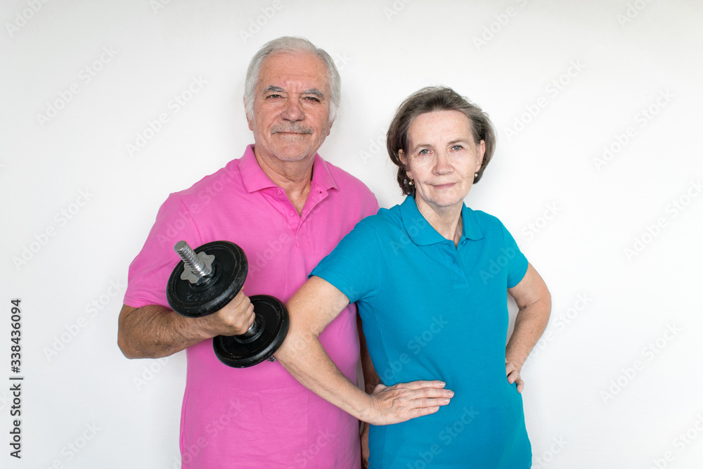 healthy white fit smiling happy senior male female couple stand posing, life is good healthy white fit smiling happy senior male female couple stand posing, life is good