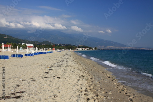 Empty beach without tourists in Greece on the background of Mount Olympus