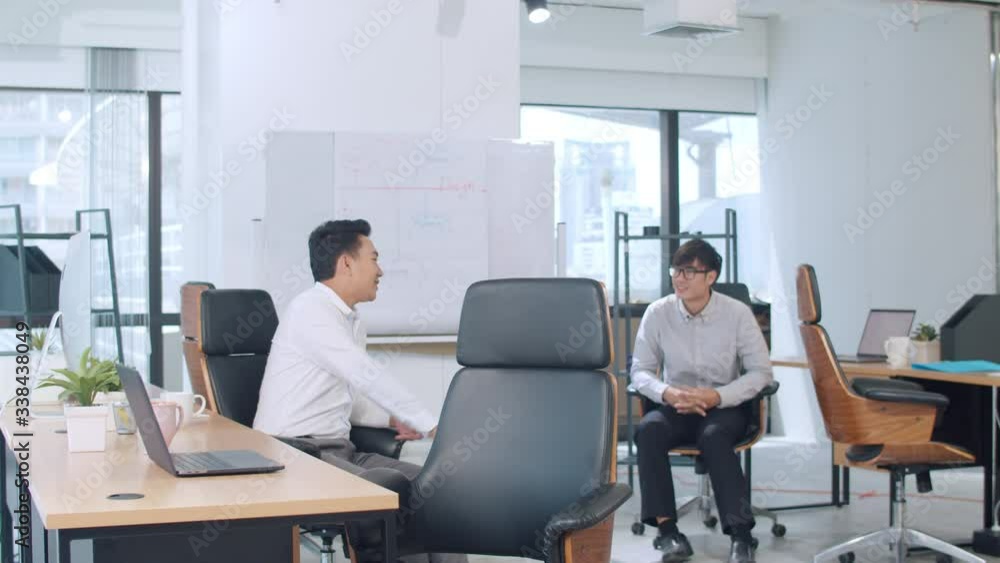 Asia businesspeople chatting to intern discussing job interview colleagues having conversation and communication meeting brainstorming ideas about project working plan success strategy in office. Asia businesspeople chatting to intern discussing job interview colleagues having conversation and communication meeting brainstorming ideas about project working plan success strategy in office.