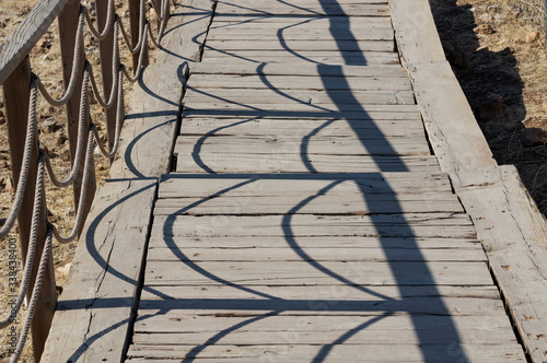 Shadows on the wooden bridge