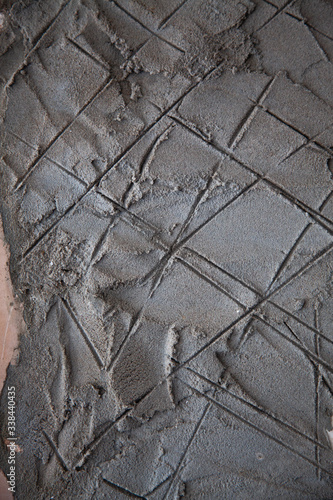 A crosshatched texture on a wall
