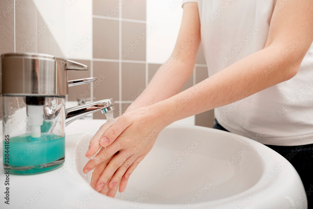 Washing hands with soap under the faucet with water for coronavirus prevention, hygiene to stop spreading coronavirus. Hygiene concept, Hygiene sanitary, clean, wash, disinfect hygienic human. Washing hands with soap under the faucet with water for coronavirus prevention, hygiene to stop spreading coronavirus. Hygiene concept, Hygiene sanitary, clean, wash, disinfect hygienic human.
