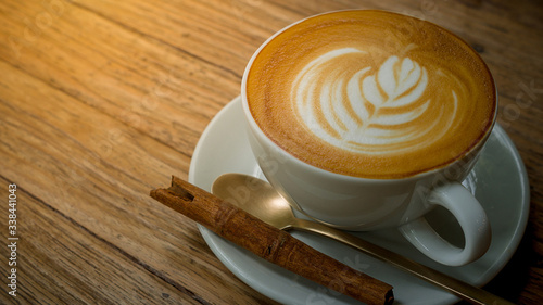 close-up coffee cup on wooden table top view.