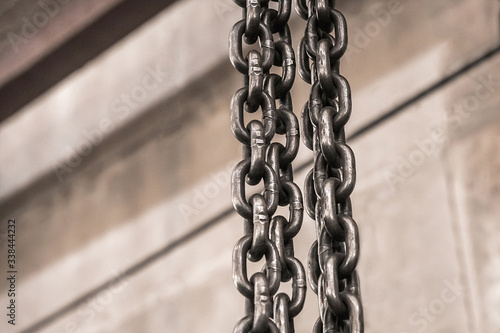 Slika na platnu Chain hoisting device at an industrial enterprise, chain, tool in a reinforcing