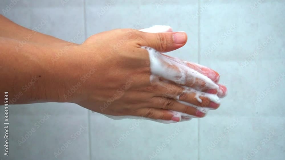 Asian man washing hands the best way. Asian man washing hands the best way.