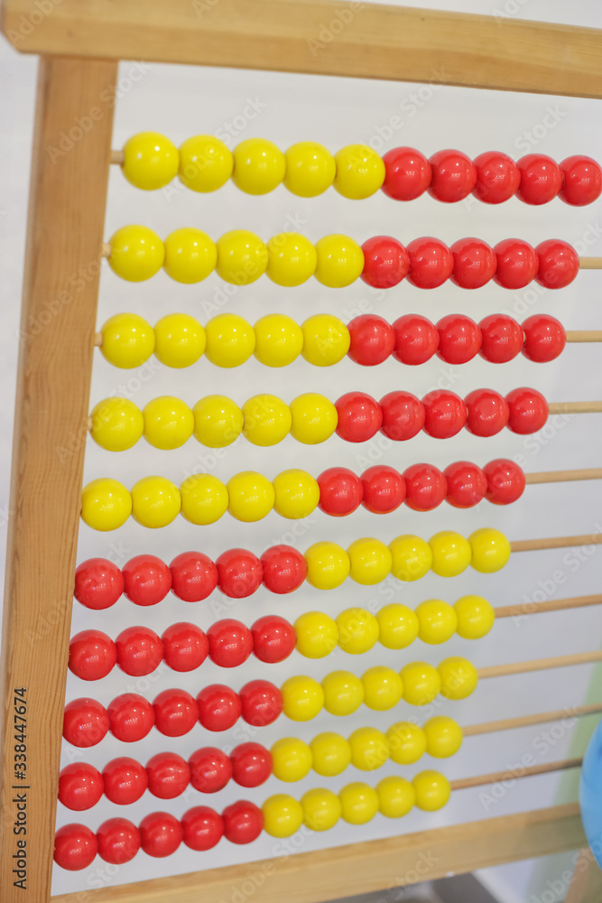 antique wooden red and yellow abacus isolated in classroom antique wooden red and yellow abacus isolated in classroom