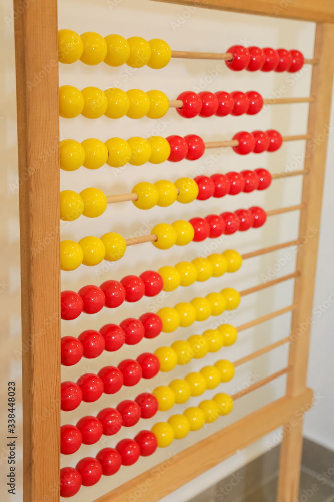 antique wooden red and yellow abacus isolated in classroom antique wooden red and yellow abacus isolated in classroom