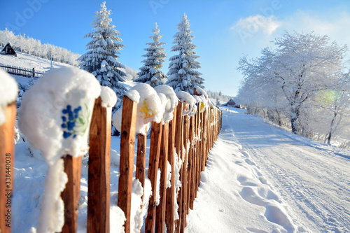 snow covered fence