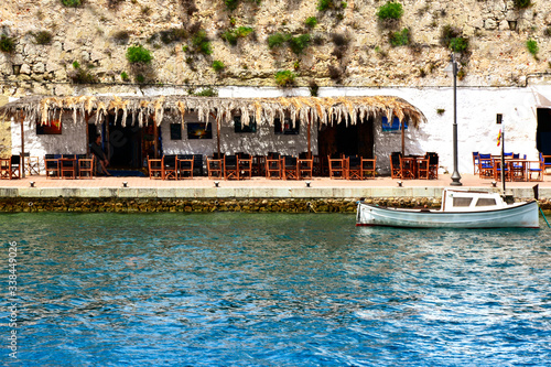 old tavern with boat in the port of mahon menorca spain 