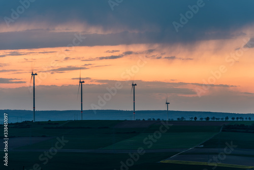 sunset over wind turbines