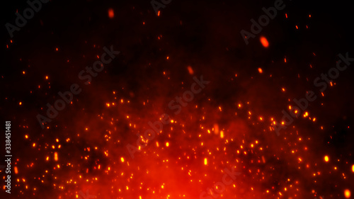 Fire embers particles over black background. Fire sparks background. Abstract dark glitter fire particle lights.