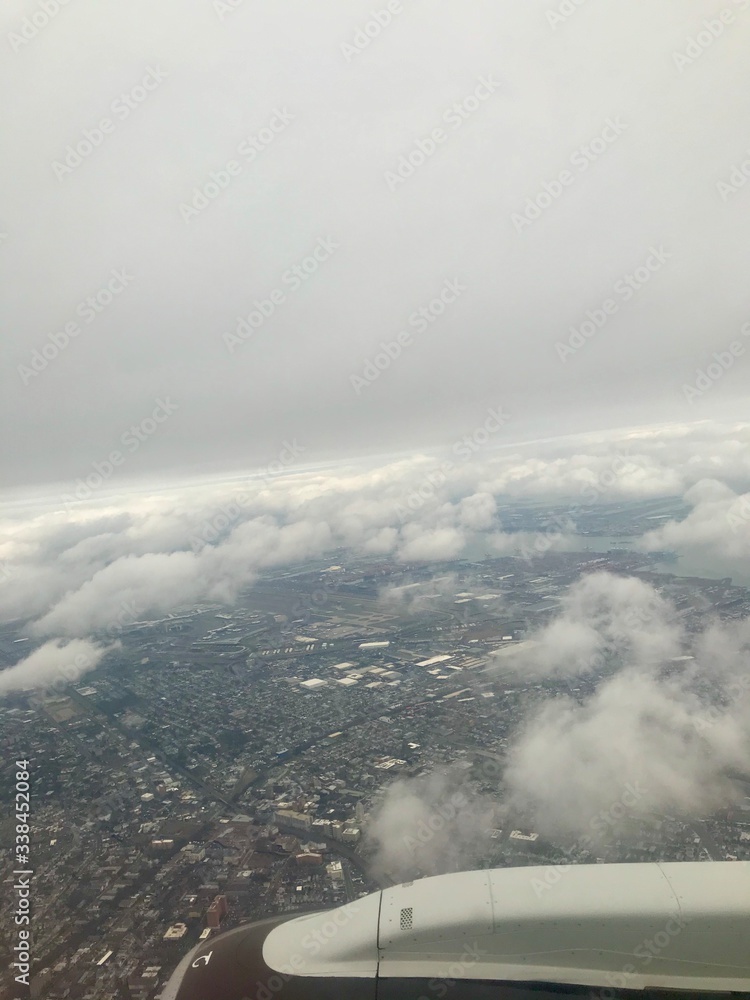 Obraz premium Aerial birds eye view of Elizabeth & Newark, New Jersey (United States of America) close to EWR airport: Urban downtown, highway & turnpike transportation, busy industrial cityscape around the port