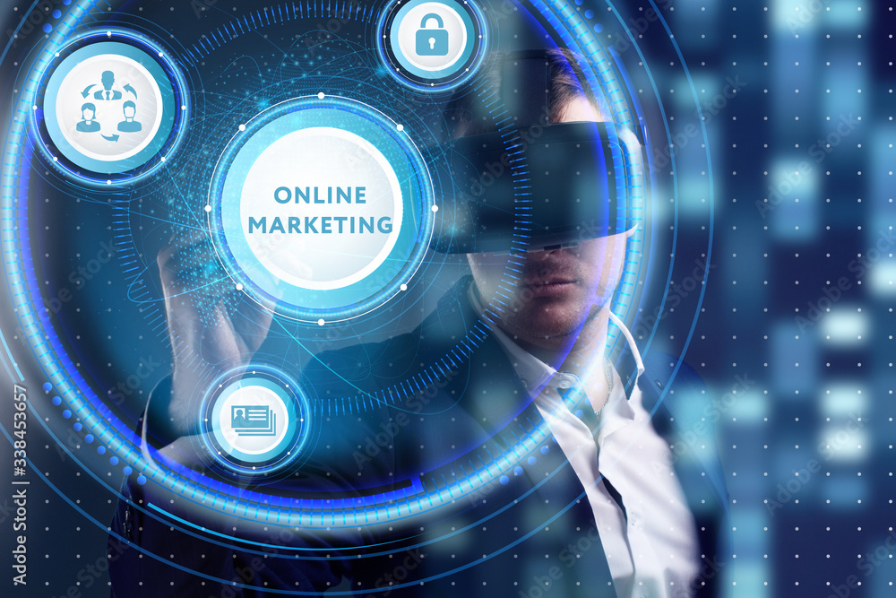 Obraz premium Business, Technology, Internet and network concept. Young businessman working on a virtual screen of the future and sees the inscription: Online marketing