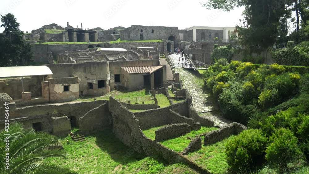 walls and ruined buildings as viewed from the main entrance to the pompeii ruins near naples, italy walls and ruined buildings as viewed from the main entrance to the pompeii ruins near naples, italy