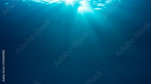 Sunburst on surface of blue underwater ocean  © Richard Carey
