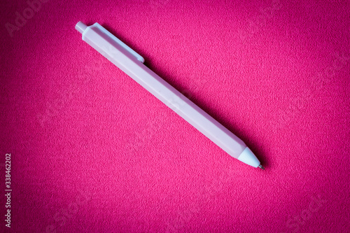 pen on pink background with vignette