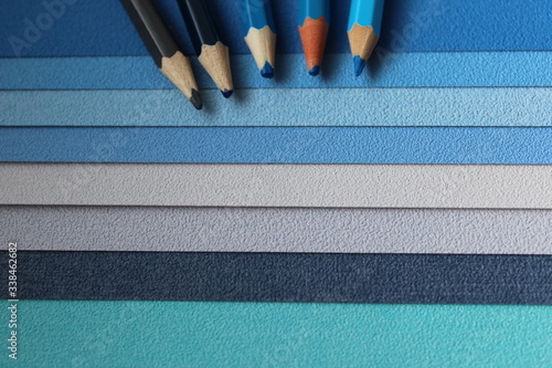 blue pencil on a blue shaded surface