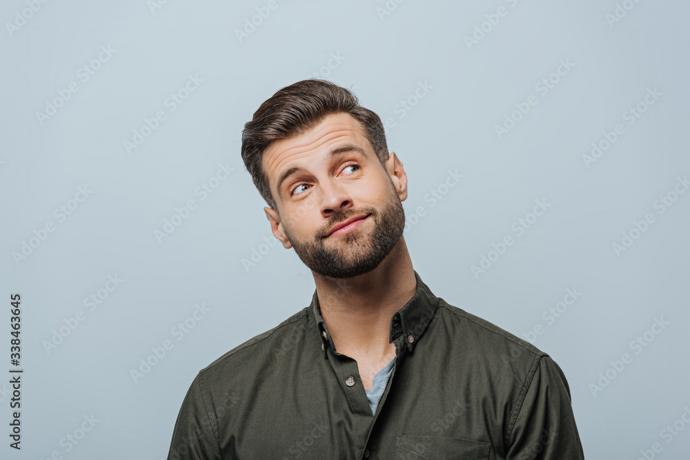 Thoughtful man looking away isolated on grey Thoughtful man looking away isolated on grey