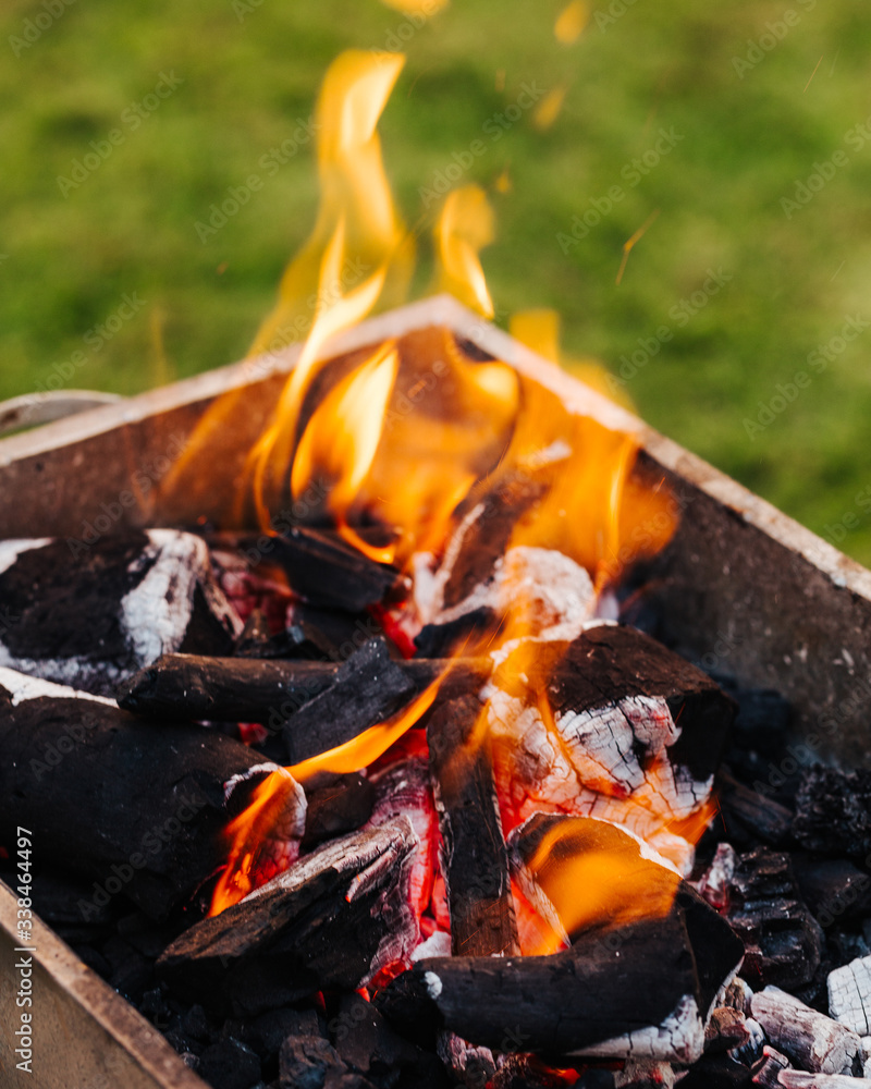 Close-up of grill. Charcoal with fire. Preparation for cooking mixed grill dishes. Close-up of grill. Charcoal with fire. Preparation for cooking mixed grill dishes.