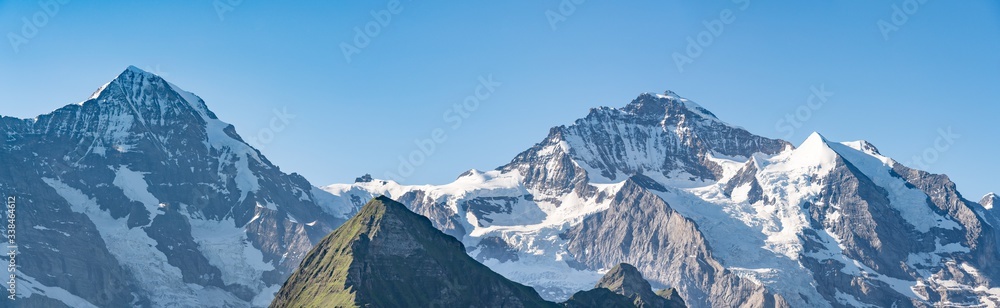 Switzerland, Panoramic view on Eiger, Monch and Jungfraujoch and green Alps around