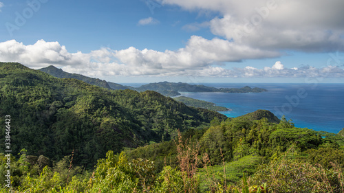 A tropical Mountain Landscape was taken from the top of one of the mountains on the island of Mahe in Seychelles. This is from the north part of the island looking out into the Indian Ocean.