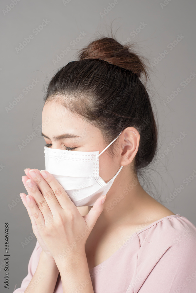 close up woman face is wearing surgical mask close up woman face is wearing surgical mask