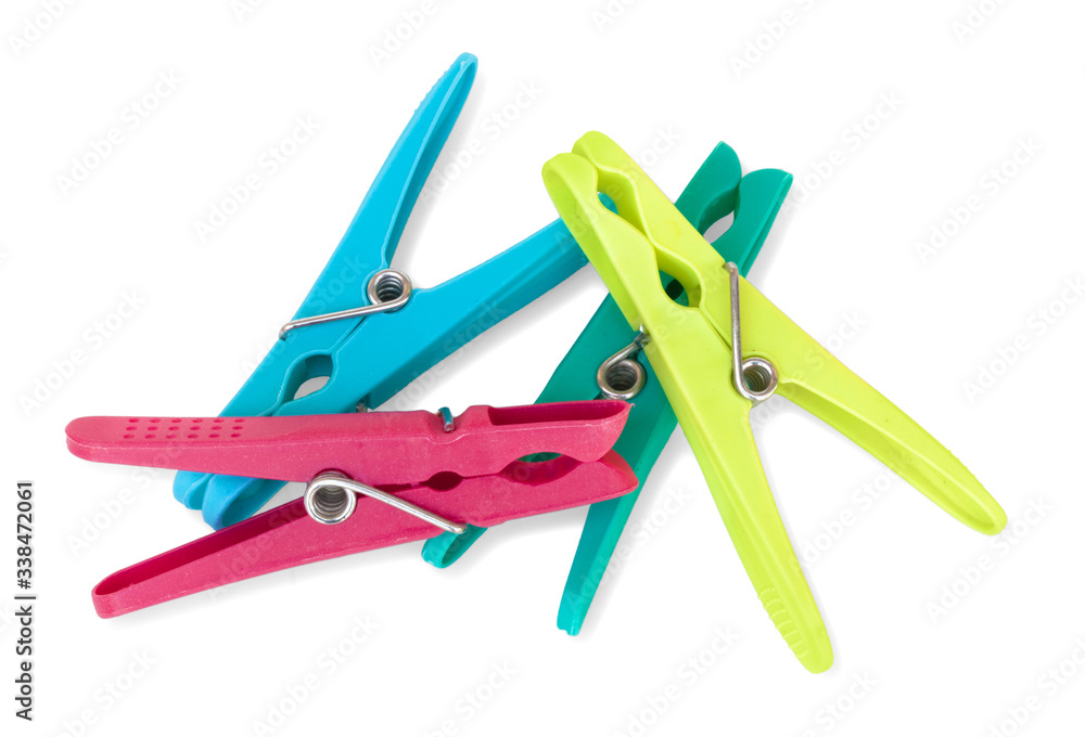 Clothes pegs. Isolated on white background with natural shadow. Many clothes pegs on the white bg. Clothes pegs. Isolated on white background with natural shadow. Many clothes pegs on the white bg.