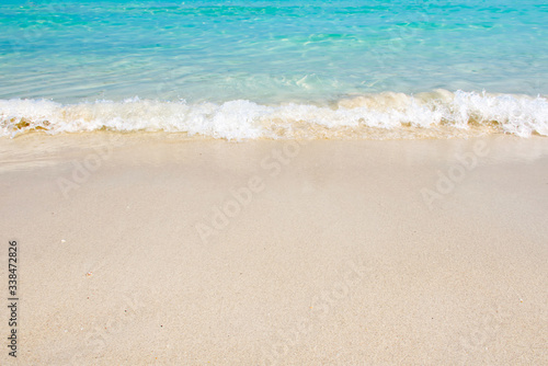 Beautiful white sandy beach with The blue sea soft wave