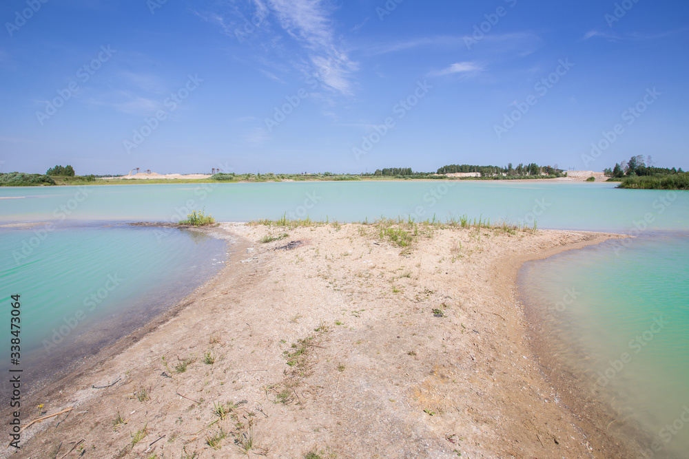 Sand quarry oopen pit with blue water