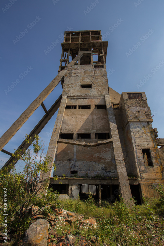 Ruins of abandoned mining headframe buidings