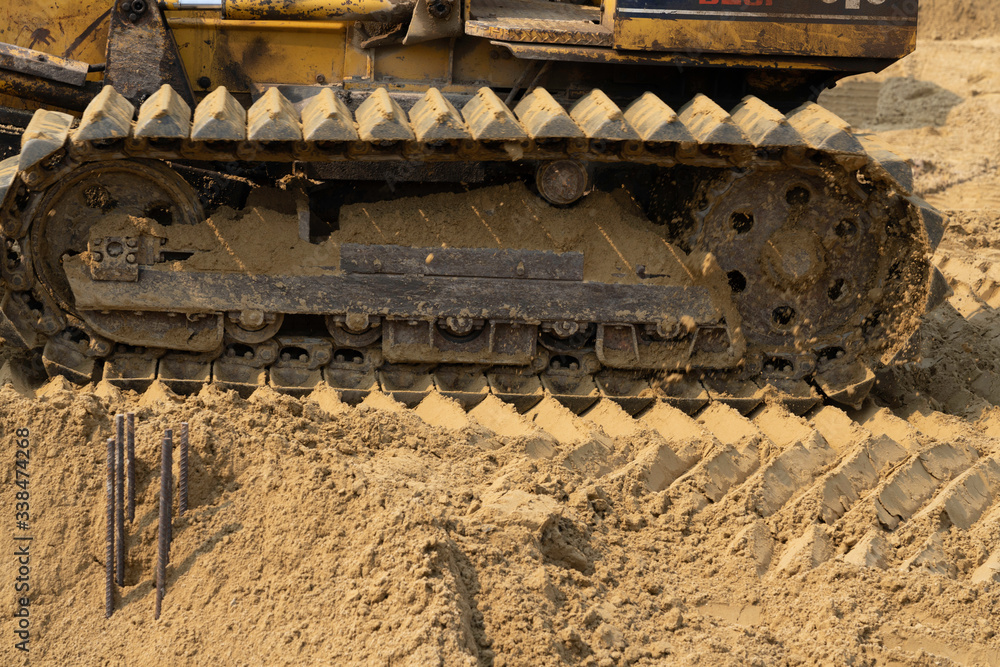 The track of bulldozer on the sand.