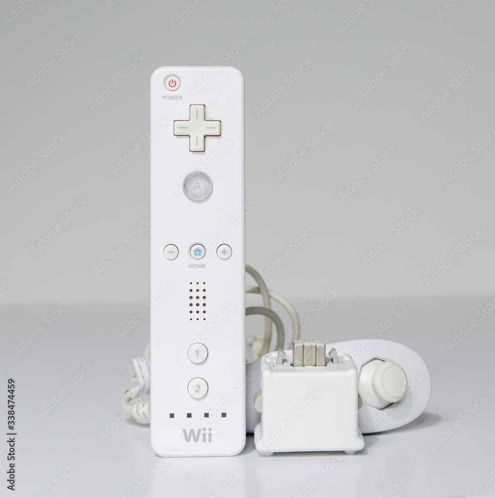 london, england 05/052019 A white Nintendo wii Controller with motion plus  adaptor and nunchuck on a white isolated background. iconic retro vintage  video gaming controller machine. Stock Photo | Adobe Stock