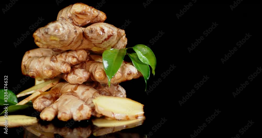 With ginger root dripping drops of water. With ginger root dripping drops of water.