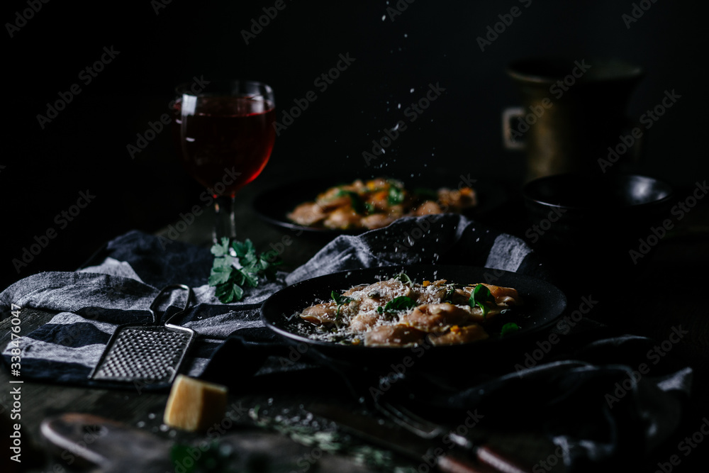 Ravioli with pumpkin and cheese on a dark background Ravioli with pumpkin and cheese on a dark background