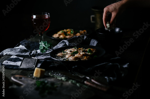 Ravioli with pumpkin and cheese on a dark background