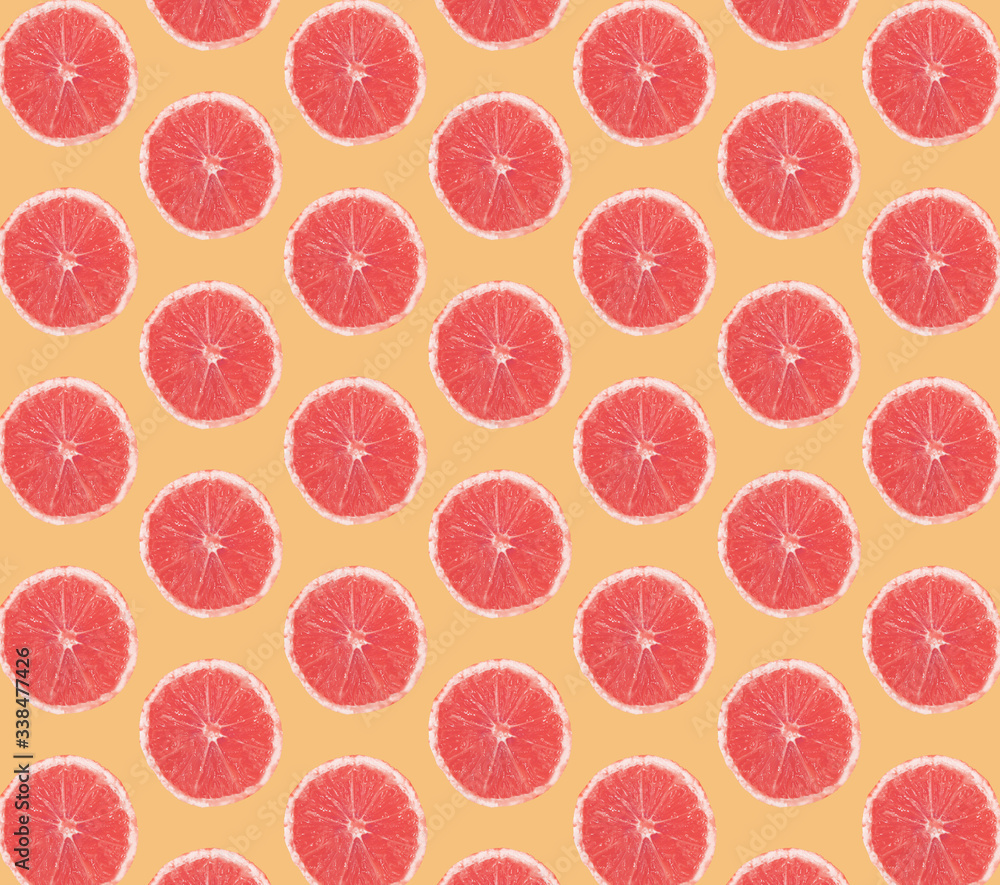 grapefruits on orange background seamless wallpaper