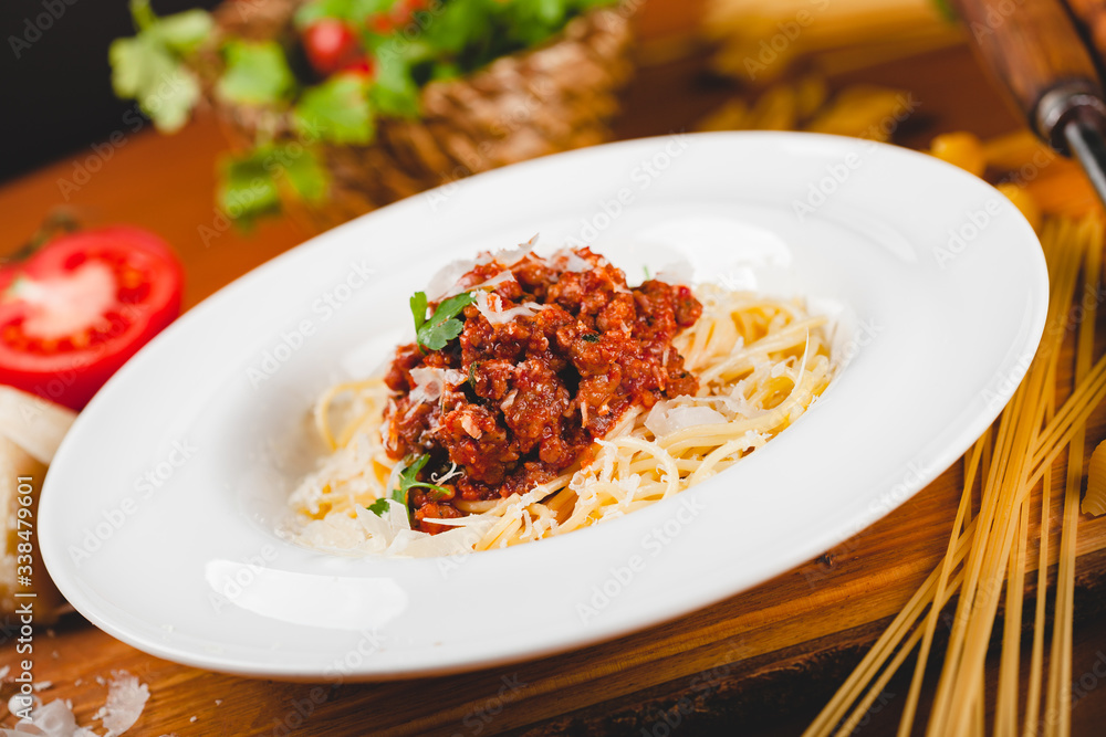 Spaghetti bolognese with tomato sauce, minced meat and grated parmesan cheese. Italian pasta. Spaghetti bolognese with tomato sauce, minced meat and grated parmesan cheese. Italian pasta.