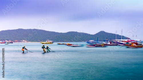 tropical beach with boats