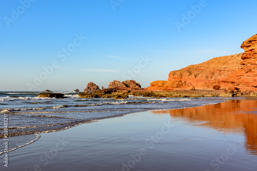 Landscape of Legzira Beach with its natural arches at the coast of Atlantic ocean. Legzira Beach is located on the ocean coast of Morocco, in Sidi Ifni, close to Agadir.